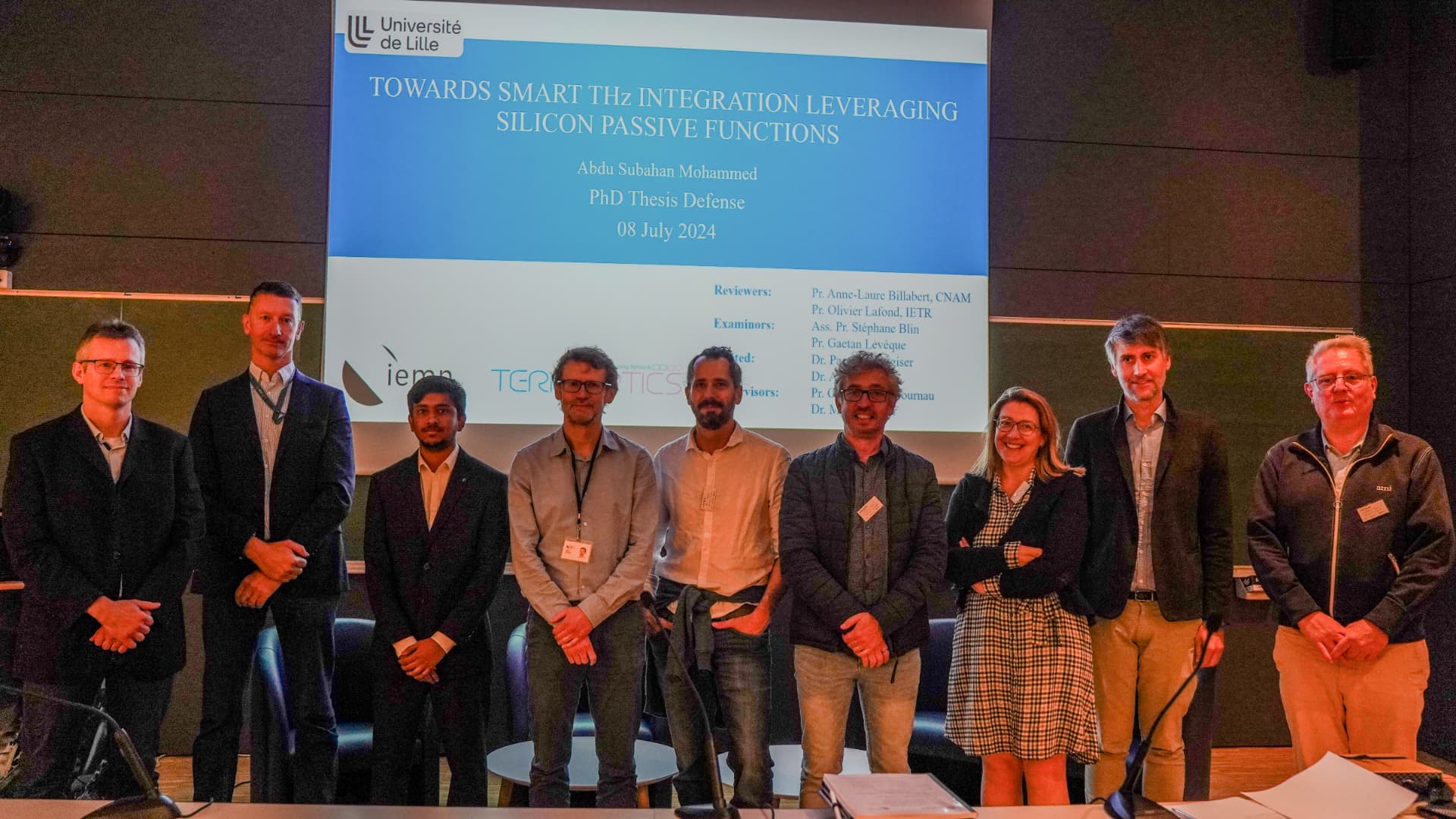 PhD thesis defence jury and candidate in front of the title slide at Université de Lille